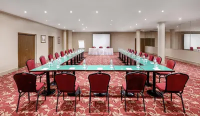 a large conference room with a long table and chairs at Iberotel Luxor in Luxor