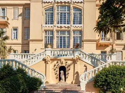 a building with stairs in front of it at Sofitel Winter Palace Luxor in Luxor