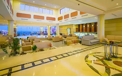 a lobby with couches and chairs in a building at Casa Mare Resort - ex, Royal Tulip Beach Resort in Port Ghalib