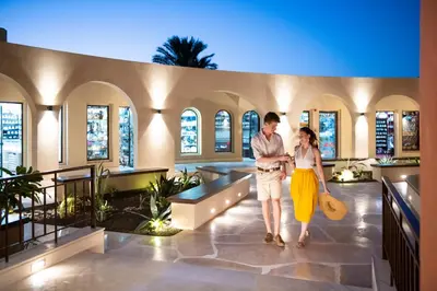 a man and a woman standing in a building at Three Corners Ocean View El Gouna - Adults Only in Hurghada