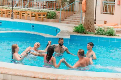 a group of people in a swimming pool at Empire Hotel Aqua Park in Hurghada