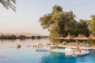 a pool at a resort with a body of water at Jolie Ville Hotel & Spa Kings Island Luxor in Luxor