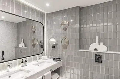 a bathroom with two sinks and a large mirror at Steigenberger Golf Resort El Gouna in Hurghada