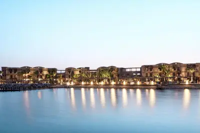 a large body of water with buildings and palm trees at Cook’s Club El Gouna (Adults Only) in Hurghada