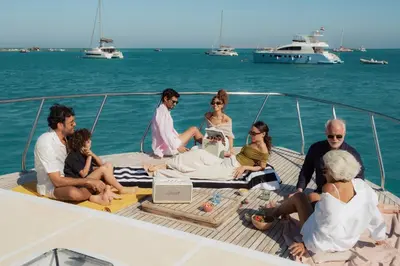a group of people sitting on the deck of a boat at Ali Pasha Hotel in Hurghada