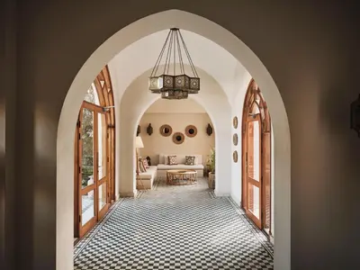 an arched hallway with a chandelier in a house at Ali Pasha Hotel in Hurghada