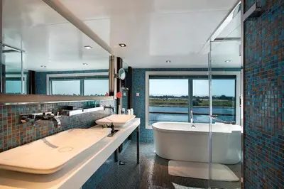 a bathroom with a tub and a sink and a bath tub at The Oberoi Philae Nile Cruise - 6 nights and 4 nights in Luxor