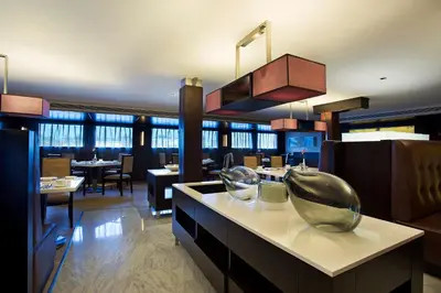 a restaurant with a dining room with tables and chairs at The Oberoi Philae Nile Cruise - 6 nights and 4 nights in Luxor