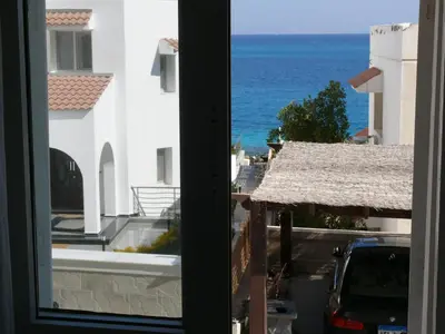 a view of the ocean from a window at Mini-Studio With Free Private Beach in Hurghada
