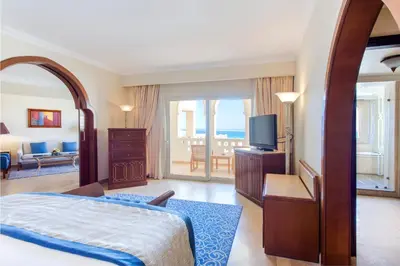 a hotel room with a bed and a television at Kempinski Hotel Soma Bay in Hurghada