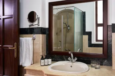 a bathroom with a sink and a shower at Hotel Sultan Bey Resort in Hurghada