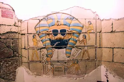 a mural on the side of a wall at Gaddis Hotel, Suites and Apartments in Luxor