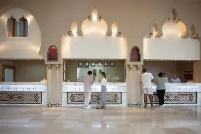 a group of people standing in front of a restaurant at Sunny Days Palma De Mirette Resort & Spa in Hurghada
