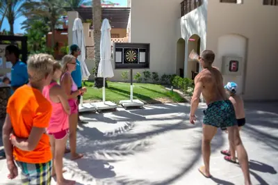 a group of young children playing a game of volleyball at JAZ Makadina in Hurghada