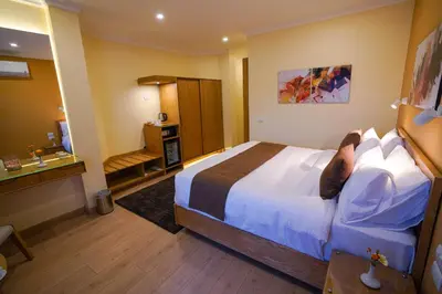a hotel room with a bed and a bathroom at Obelisk Nile Hotel Aswan in Aswan