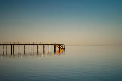 a pier in the middle of a body of water at Royal Beach Serviced Apartments in Hurghada