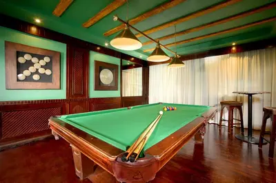 a billiard room with a pool table in it at JAZ Neo Dar El Madina in Coraya Bay