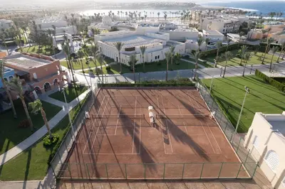 an overhead view of a tennis court in a city at JAZ Neo Dar El Madina in Coraya Bay