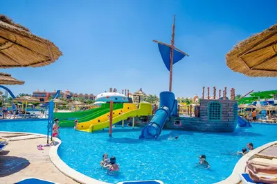 a pool at a resort with people in the water at Titanic Beach - Families and Couples only in Hurghada