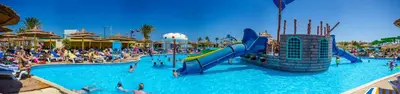 a large swimming pool with people in a resort at Titanic Beach - Families and Couples only in Hurghada