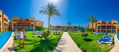 a resort with a pool and palm trees and a resort at Titanic Beach - Families and Couples only in Hurghada