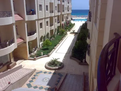 an empty street in a building next to the ocean at Palm Beach Apartments 302B in Hurghada