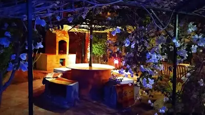 a room with a tree with blue flowers on it at Hurghada Big private villa for families in Hurghada