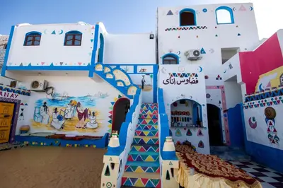 a play house with a staircase in front of it at Fadlos Anay Nubian Guesthouse فضلوس أناي in Aswan