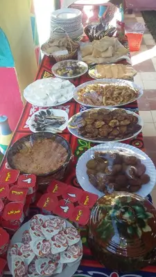 a table with many plates of food on it at Fadlos Anay Nubian Guesthouse فضلوس أناي in Aswan