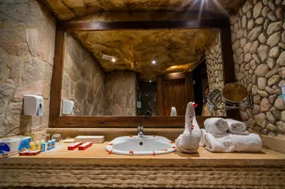 a bathroom with a sink and a mirror at Caves Beach Resort Adults Only in Hurghada