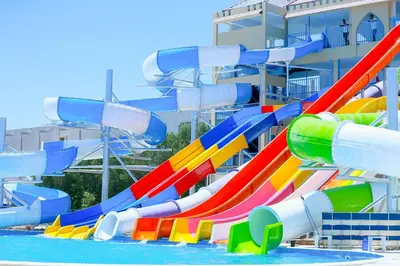 a water slide in a swimming pool at Gravity Hotel & Aqua Park Hurghada Families and Couples Only in Hurghada