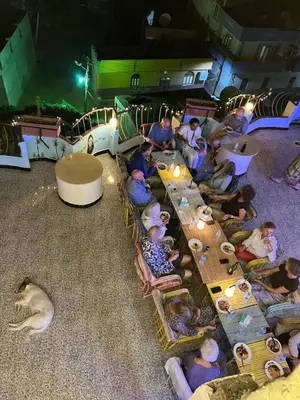 a group of people sitting on a train at night at The Mango Guest House in Aswan