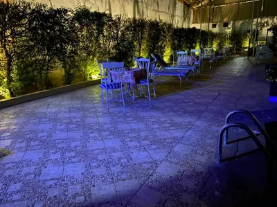 a row of blue chairs sitting on a patio at Shady Hotel Luxor in Luxor