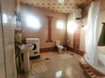 a bathroom with a sink and a toilet at Luxor palace Apartments in Luxor