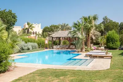 a swimming pool in the yard of a house at El Gouna South Marina 1 Bedroom Apartement with private Jacuzzi in Hurghada