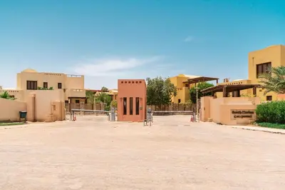 a group of buildings in a desert with a dirt road at El Gouna South Marina 1 Bedroom Apartement with private Jacuzzi in Hurghada
