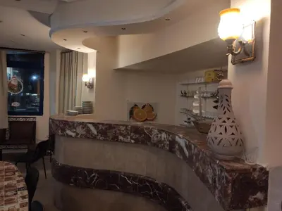 a lobby with a stone counter with a light on it at Canary Hotel in Hurghada