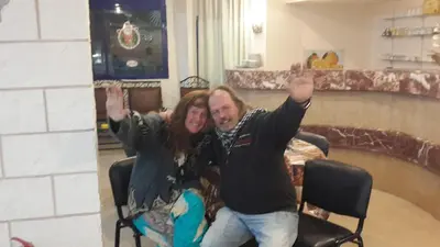 a man and a woman are posing for a picture at Canary Hotel in Hurghada