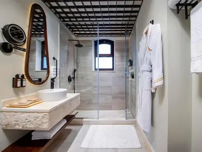 a bathroom with a sink and a shower at Movenpick Resort El Quseir in Quseir