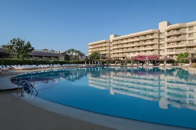 a large swimming pool in front of a hotel at Sindbad Club in Hurghada