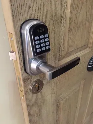 a door with a cell phone sticking out of it at Pool View Apartment at British Resort - Unit 02 in Hurghada