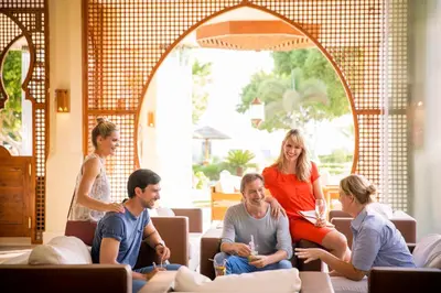 a group of people sitting around in a room at Robinson Soma Bay in Hurghada