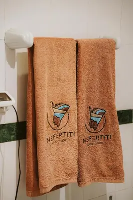 a pair of towels hanging on a wall at Nefertiti Hotel Luxor in Luxor