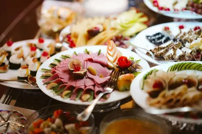 a table with many plates of food on it at Nefertiti Hotel Luxor in Luxor