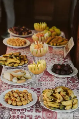 a table topped with plates of different types of food at Nefertiti Hotel Luxor in Luxor