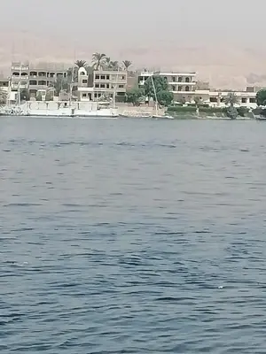 a large body of water with buildings in the background at Windsor Hotel Luxor \u60a8\u5728\u76e7\u514b\u7d22\u7684\u7b2c\u4e8c\u500b\u5bb6 in Luxor