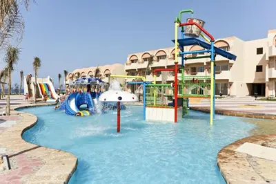 a water park with a water slide and slides at Three Corners Sea Beach Resort in Coraya Bay