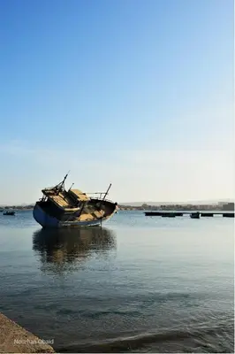 a boat that is sitting in the water at El Quseir Hotel in Quseir
