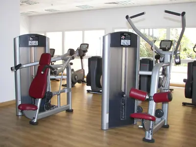 a gym with several tread machines in a room at Hurghada Suites & Apartments Serviced by Marriott in Hurghada