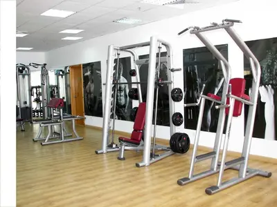 a gym with several tread machines in a room at Hurghada Suites & Apartments Serviced by Marriott in Hurghada